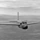 The Jetmaster retained the side-by-side bubble canopy arrangement. The original glazed nose of this test aircraft had cracked from the heat of the desert heat the cold of high altitude, so mechanics fashioned a plywood nose to keep the Jetmaster flying. (US Air Force)